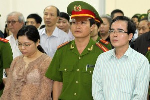 Associated Press Le Quoc Quan, right, listens to the judge during his trial in Hanoi, Vietnam.