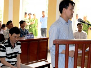 Defendants Quan and Hung during the trial for torturing detained citizens