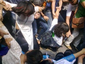 Plainclothes security agents violently disperse female environmentalists in a peaceful demonstration in Hanoi in April, 2015