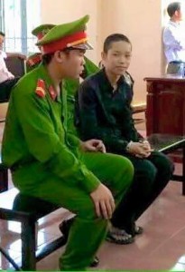 Handcuffed Nguyen Mai Trung Tuan in court room today [March 2]