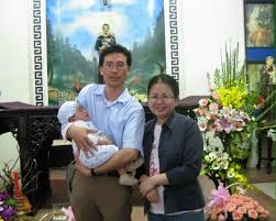 Mr. Ngo Duy Quyen, his wife Le Thi Cong Nhan and their baby Luka