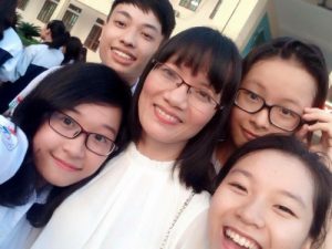 Teacher Lam (center) with her students