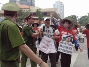Mrs. Theu (in red clothes) at a peaceful demonstration against land seizure