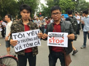 Former prisoner of conscience Pham Minh Vu (left) at a peaceful demonstration on environmental issue in Hanoi in May 2016