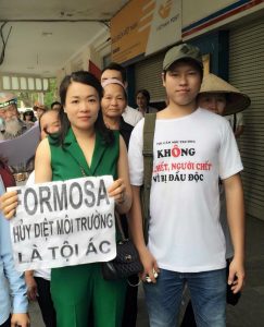 Mr. Phuong (right) at a peaceful demonstration in Hanoi in May against Formosa's pollution 