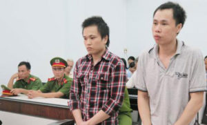 Nguyen Huu Quoc Duy (R) and Nguyen Huu Thien An in courtroom