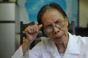 Le Hien Duc speaks to a reporter at her home in Hanoi, May 16, 2013.