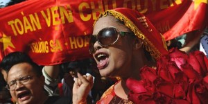 File - Bui Thi Minh Hang (R), during an anti-China protest in downtown Hanoi on July 24, 2011. 