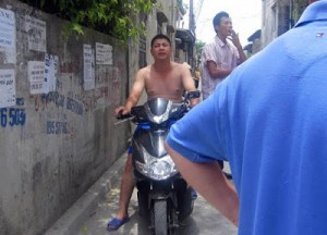 The half-naked policeman and other thugs who are so familiar  with and rude to blogger Pham Thanh Nghien in every encounter between them.