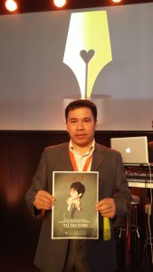 Acitivist Vu Quoc Ngu holds a banner calling for release of political prisoner Tran Huynh Duy Thuc while attending a meeting of the Stockholm-based Civil Rights Defenders
