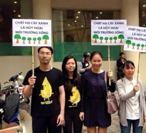 Activist Ly Quang Son (first left) in a green campaign to protest Hanoi's plan to chop down 6,700 aged trees in the city's center