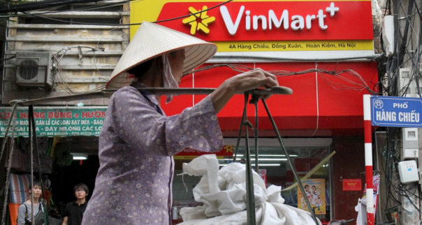 A woman walks past a Vinmart shop in Hanoi in October 2015. (Nguyen Huy Kham / Reuters/Reuters)