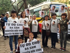 Activists gather near the court building on March 23, 2016 to support blogger Nguyen Huu Vinh and Nguyen Thi Minh Thuy