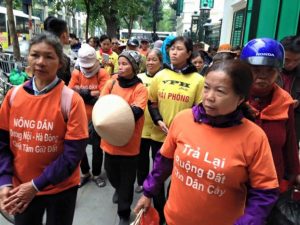 More than 100 petitioners march in Hanoi to protest the seizure of their land by local authorities, Jan. 12, 2016